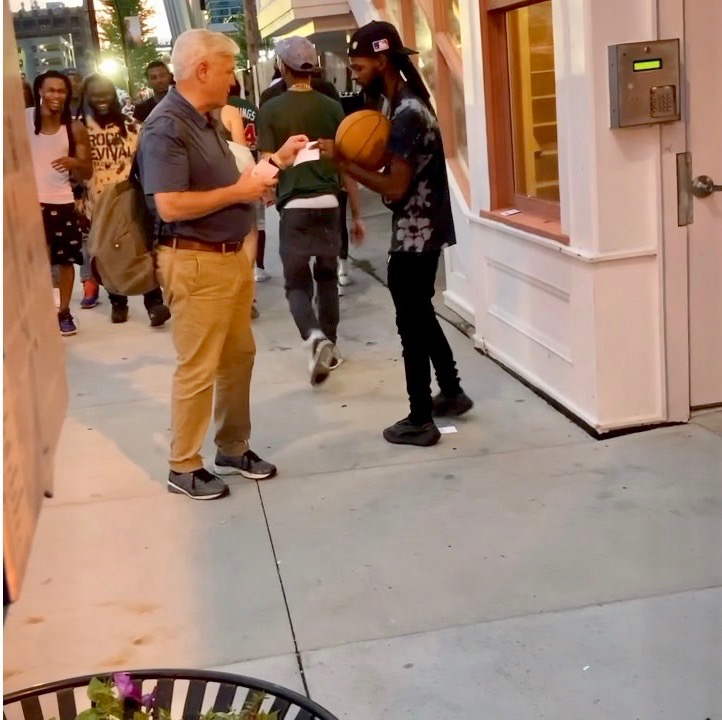 Chris-giving-a-young-man-tract